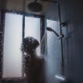 woman under showerhead